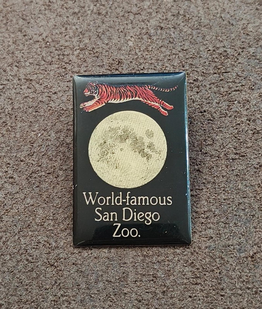 San Diego Zoo enamel pin on carpet with tiger and moon; World-famous San Diego Zoo wording