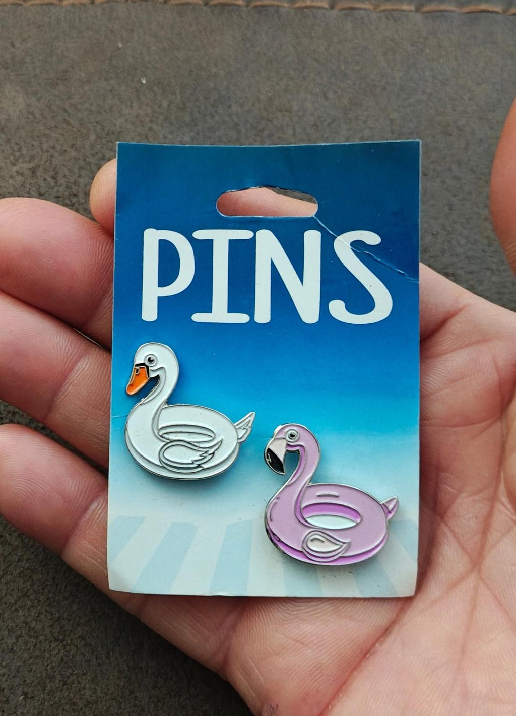 Silver-tone swan and pink flamingo enamel pins, two-piece set on card