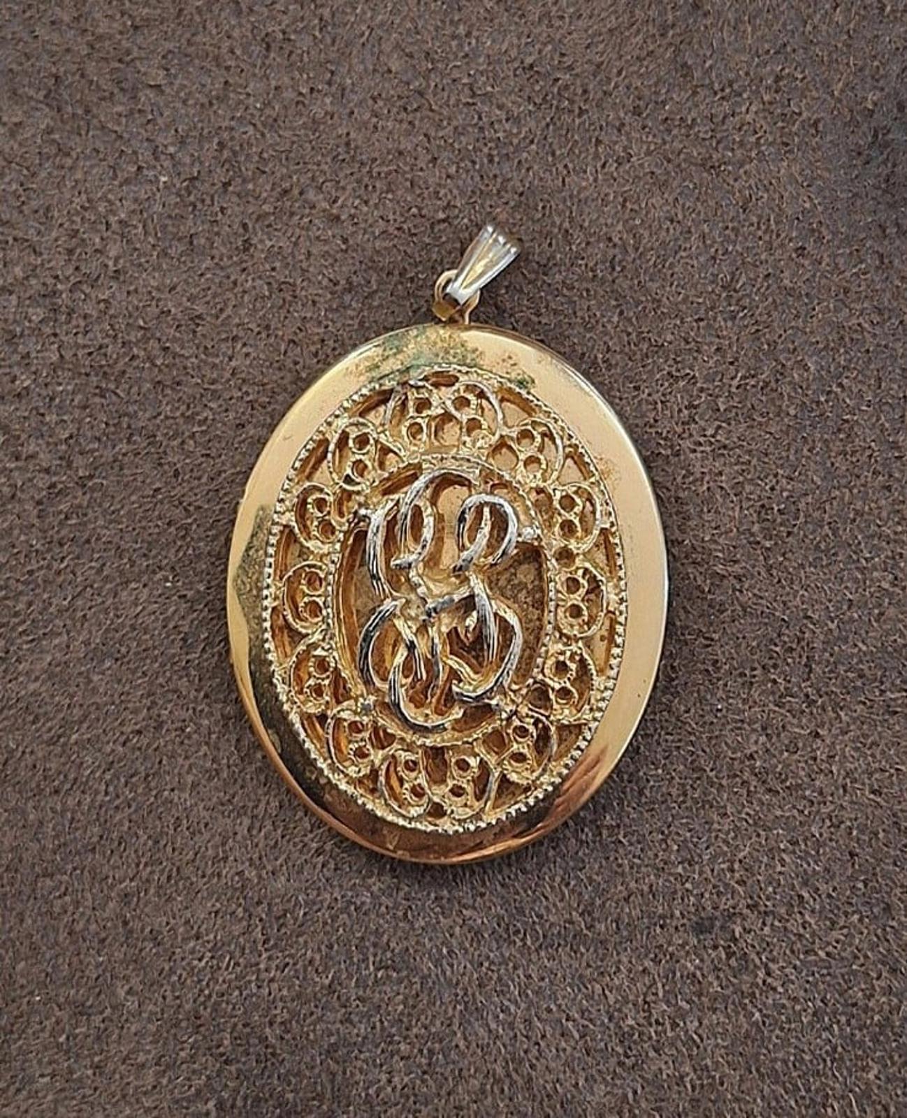 1980s Large Gold Tone Filigree Oval Locket Pendant