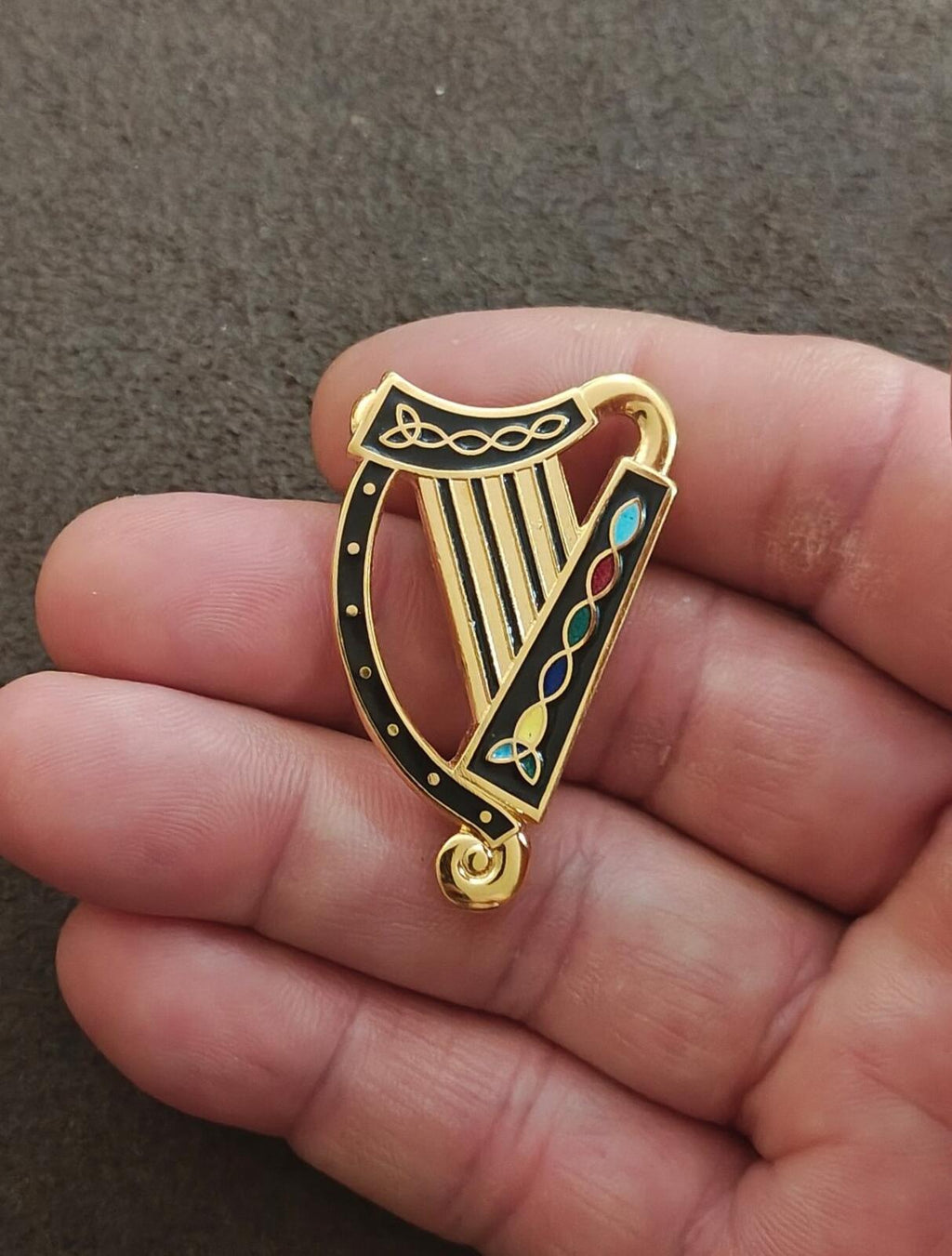 Gold-tone enamel harp charm/brooch with black border and colorful decorative inlay