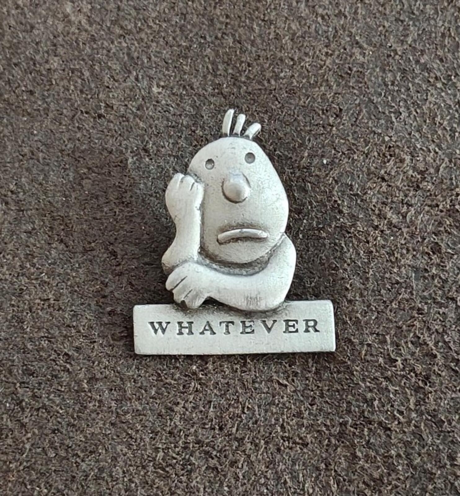 Vintage pewter cartoon pin, smiling face with raised hair on a "WHATEVER" plaque