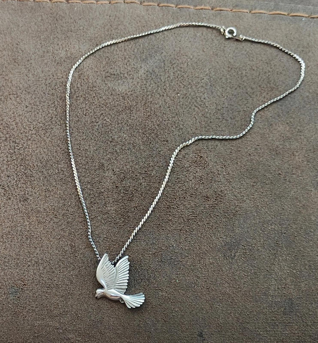 Dove pendant necklace with silver-tone chain and small round lobster clasp