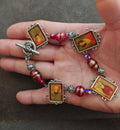 Silver plate portrait link bracelet with red glitter beads and small charm frames
