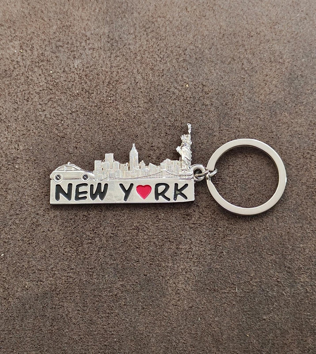 Silver New York keychain showing skyline and "NEW YORK" wordmark with red heart, key ring