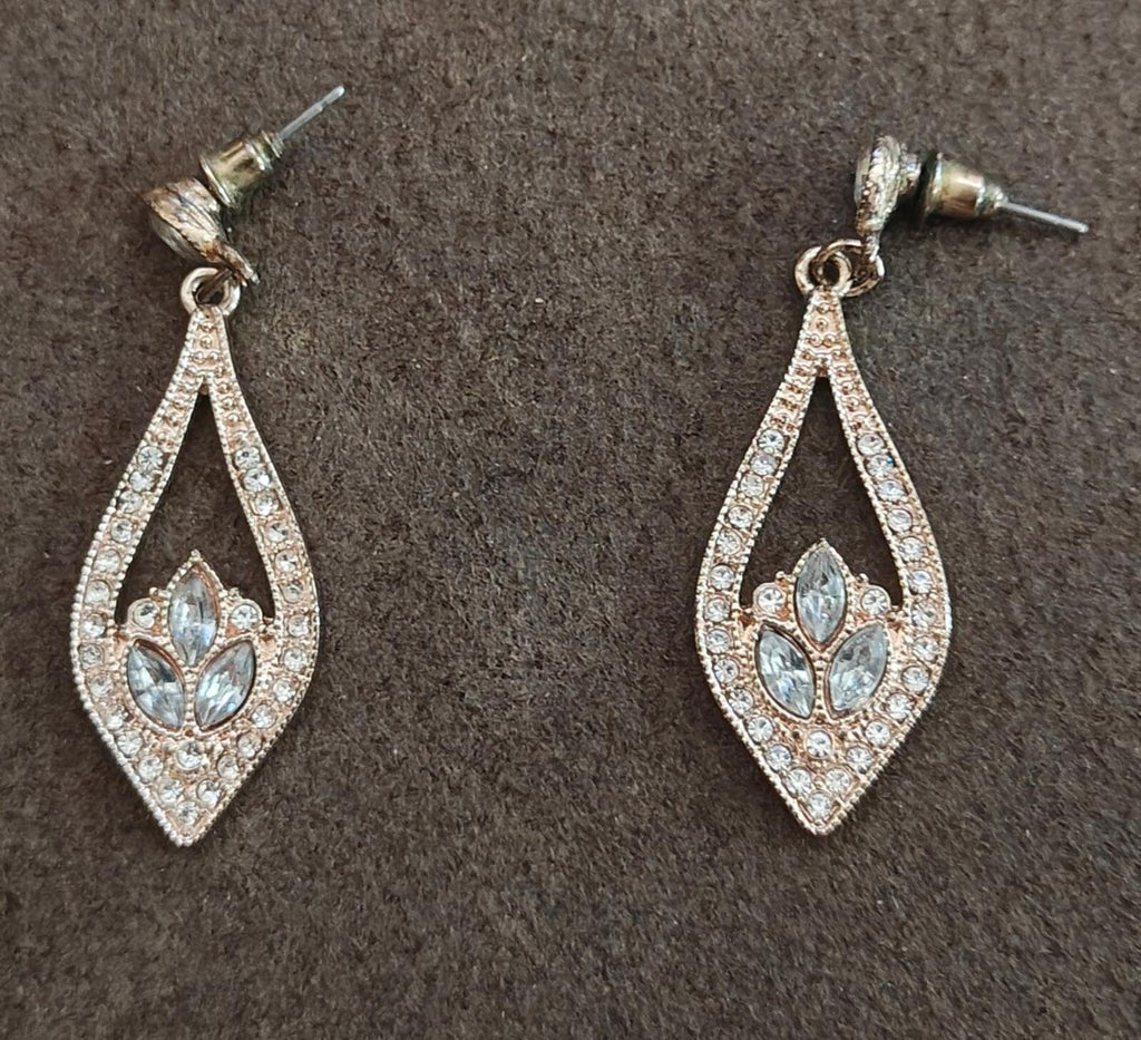 Crystal teardrop dangle earrings with light blue center stones, silver-tone settings