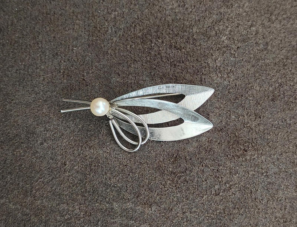 Sterling silver modernist brooch with cultured pearl and sweeping ribbon-like metal shapes