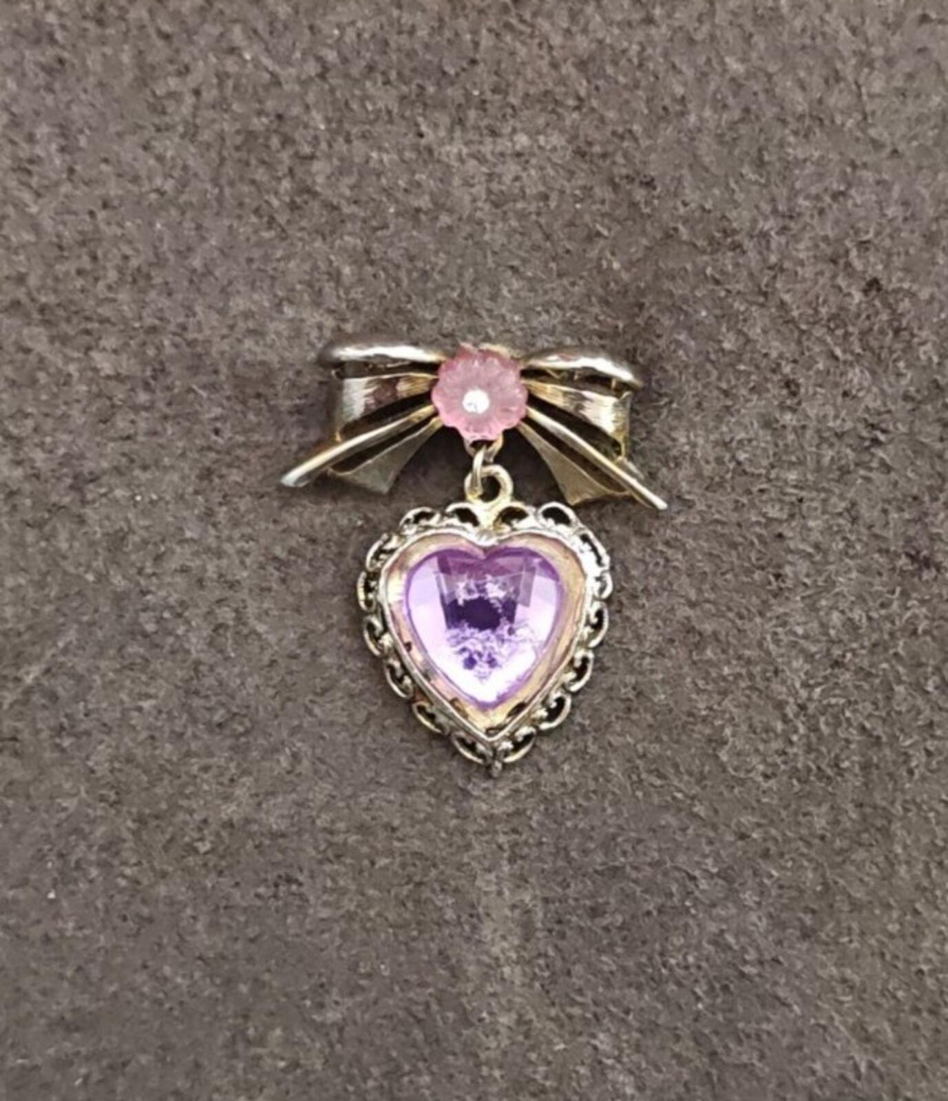 1980s Gold Tone Bow With Pink Flower & Filigree Edged Purple Stone Heart Brooch