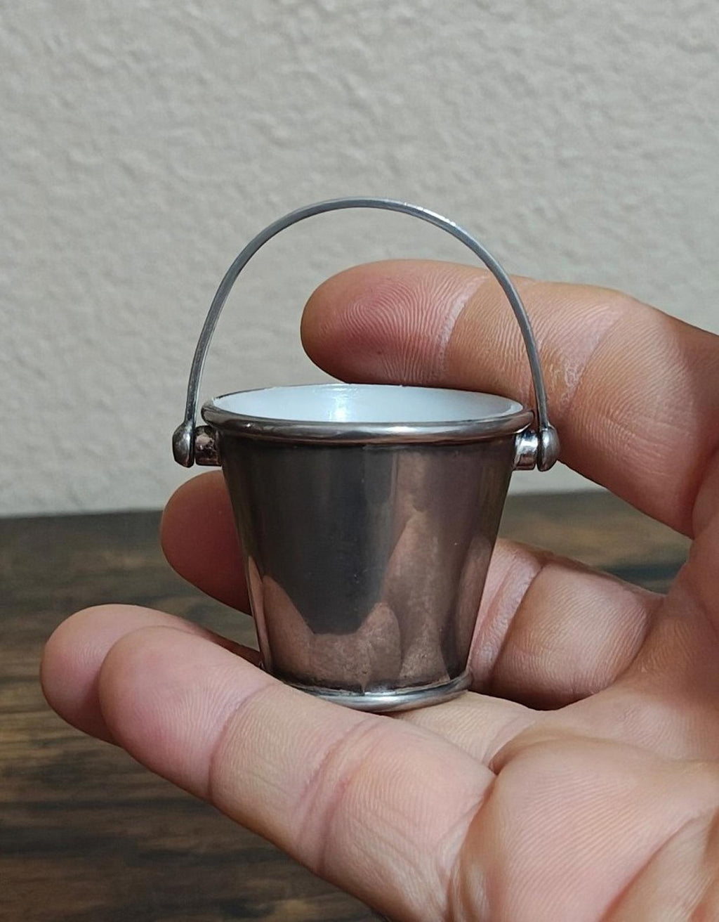 Mini silverplated bucket pail with arched handle and white interior