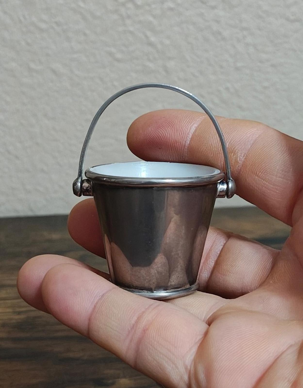 Mini silverplated bucket pail with arched handle and white interior