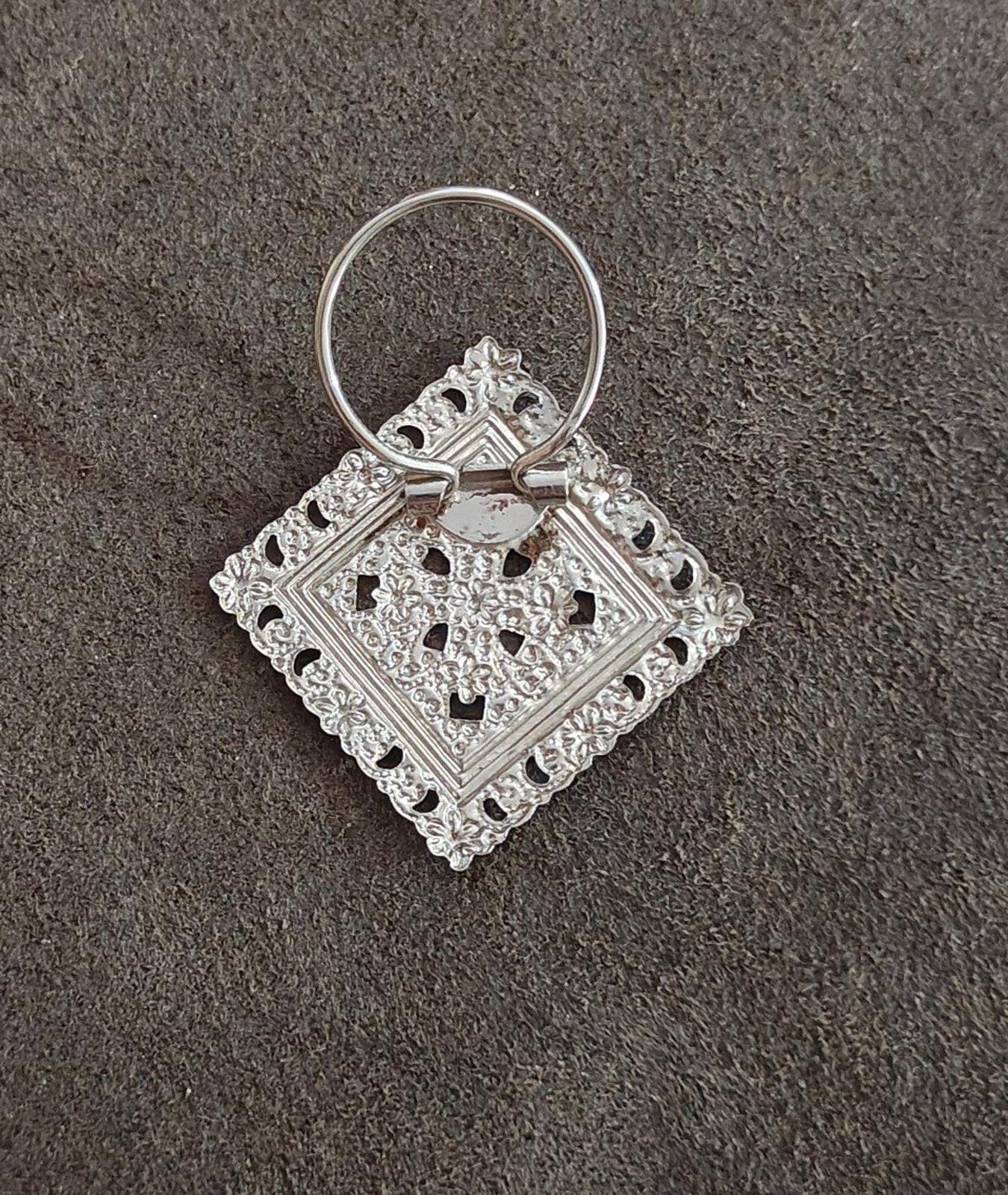 Silver-tone filigree scarf clip with round loop ring and square openwork motif