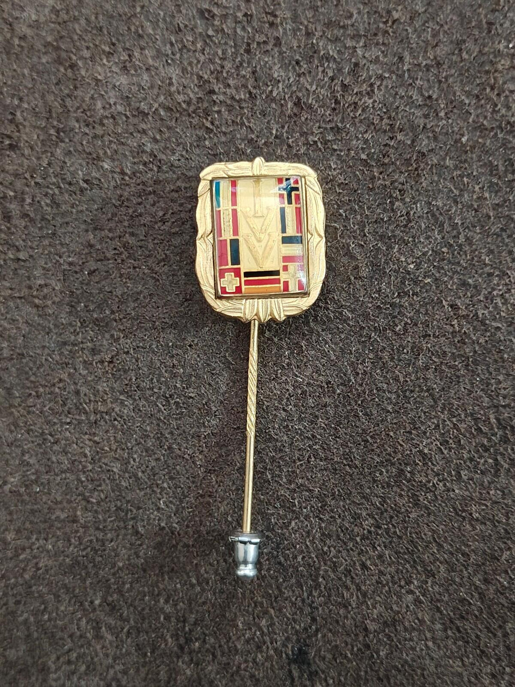 Gold-tone rectangular enamel badge pin with multicolor crest and long stick pin