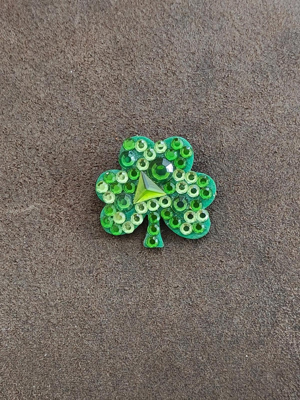 Green rhinestone shamrock brooch pin with sparkling stones and small dangling stem