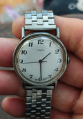 Timex Mercury men’s manual watch with silver dial and metal bracelet, round case