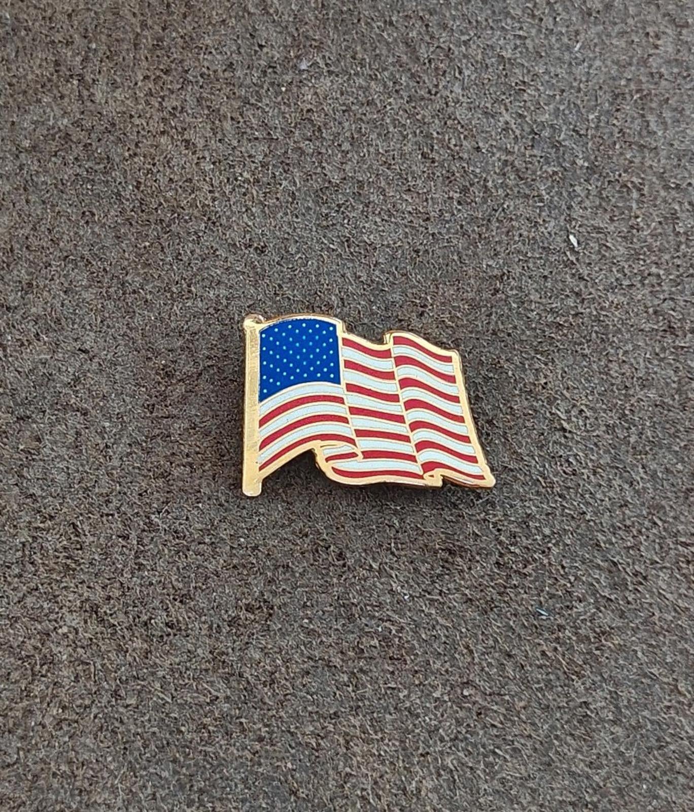 1980s Patriotic Gold Tone Enameled American Wavy Flag Pin.