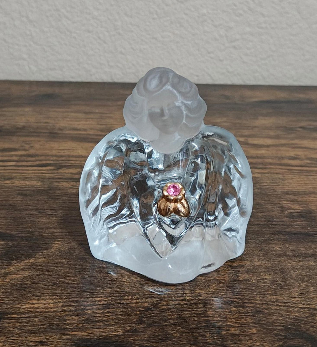 Clear glass guardian angel figurine standing, front view with pink gemstone heart
