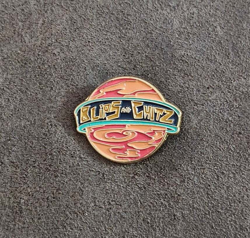 Funko Rick & Morty Blips & Chitz Exclusive Gold Tone Orange Enamel Pin.