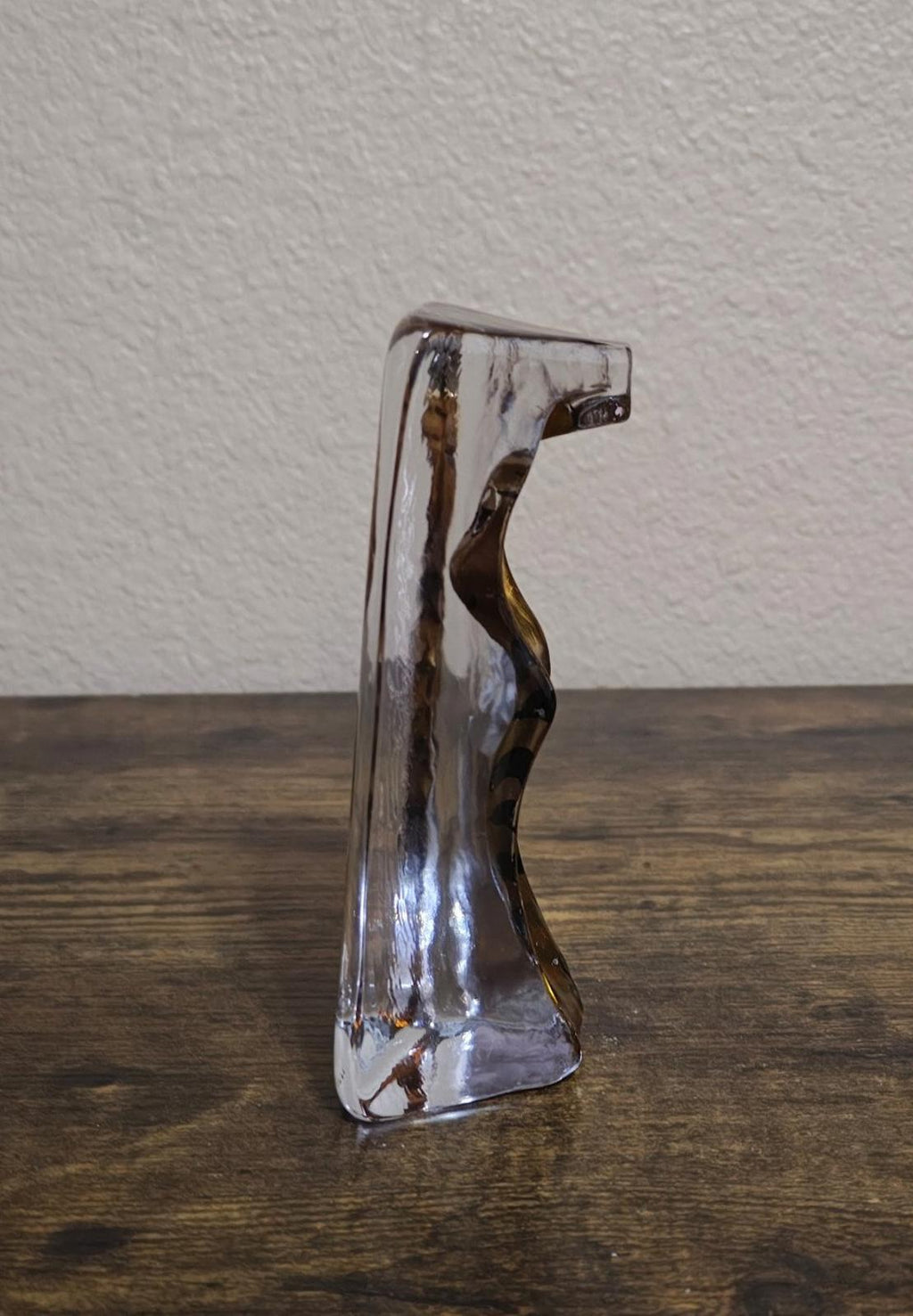 Clear cat paperweight figurine viewed from side, gold tabby face in block