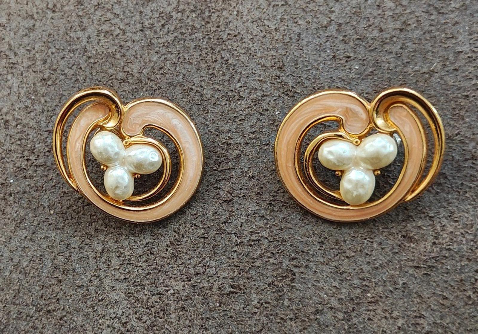 Heart pearl cabochon clip-on earrings featuring cream enamel swirl detail and gold tone metal