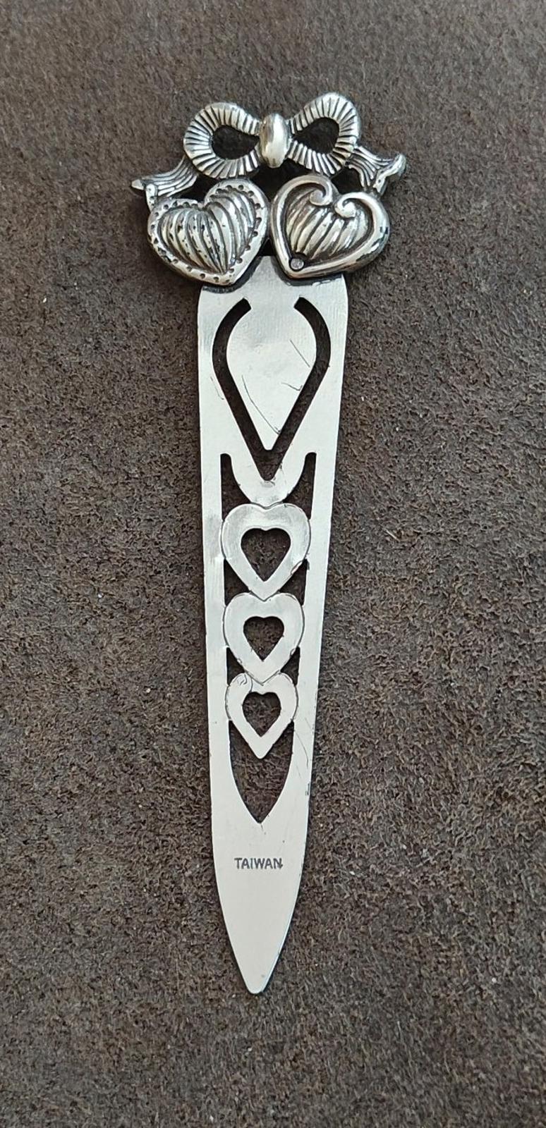 Silver plated letter opener bookmark with heart pattern and bow top, pointed tip