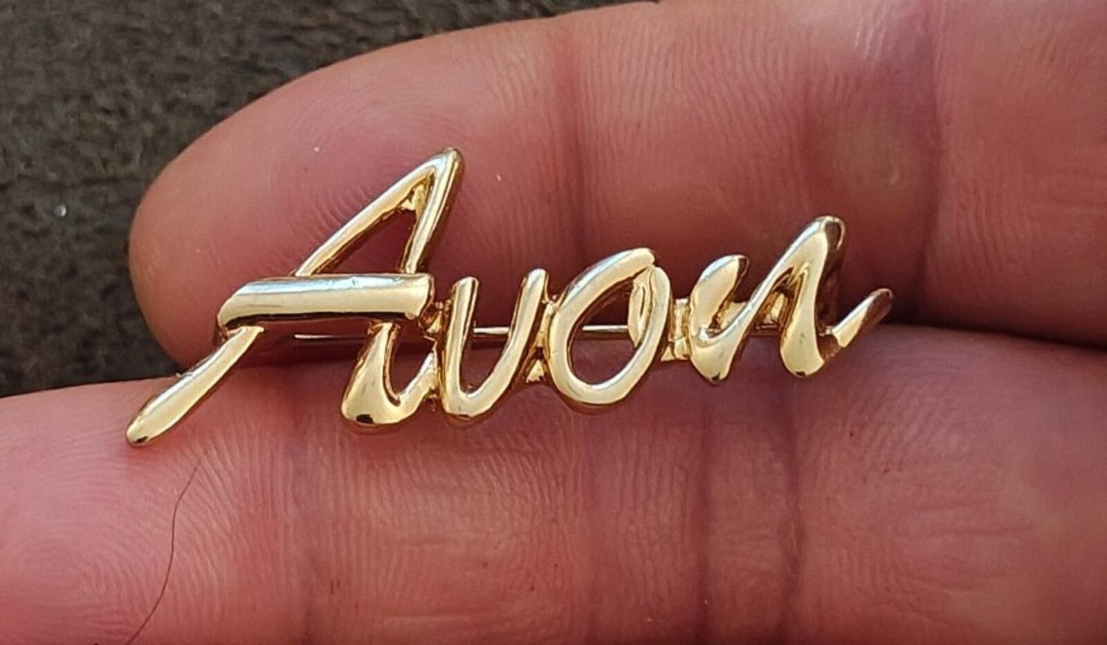 1980s/90s  Avon Gold Tone Cursive Logo Pin