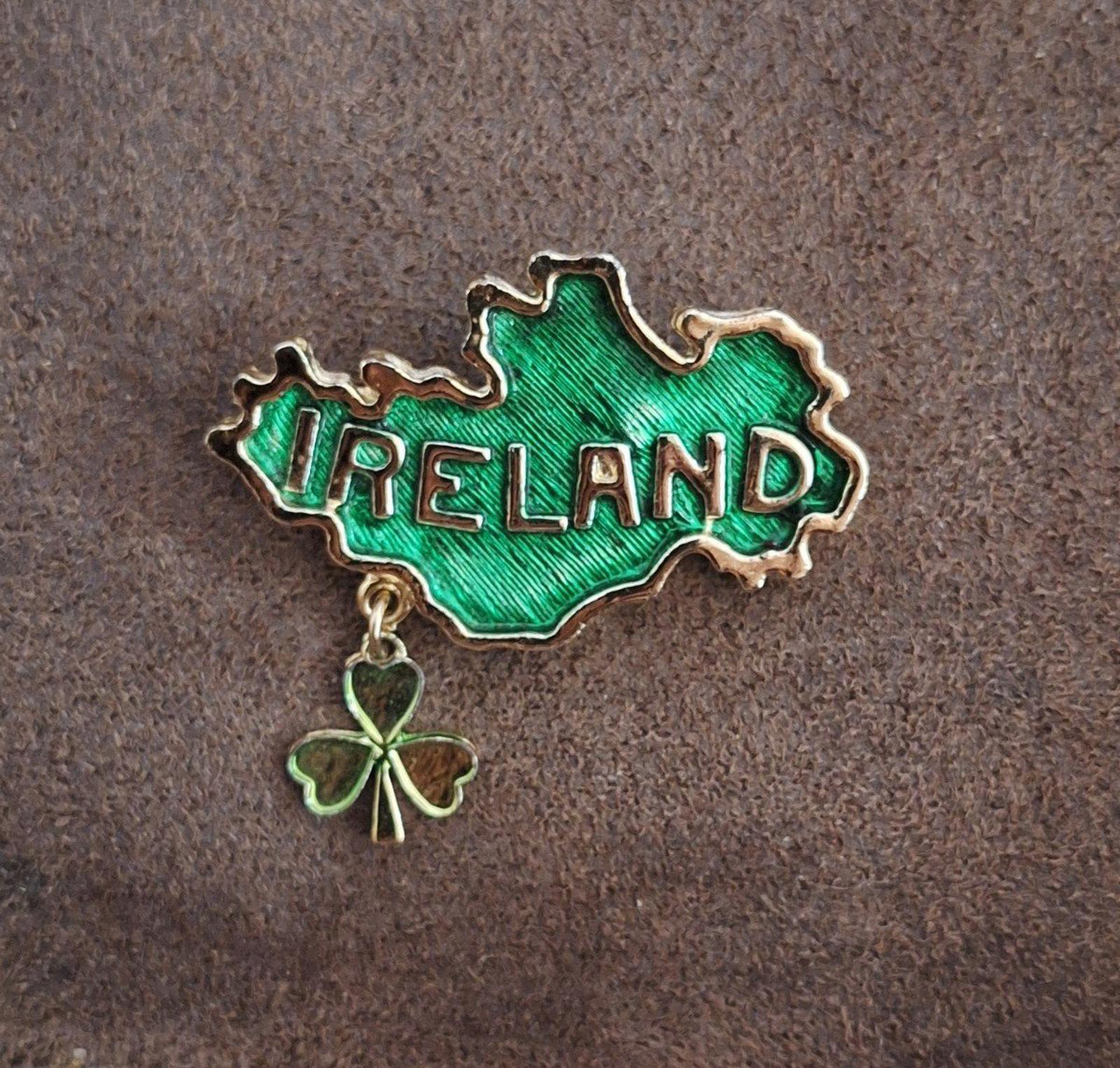Gold-tone Ireland outline charm with green enamel and dangling four-leaf clover