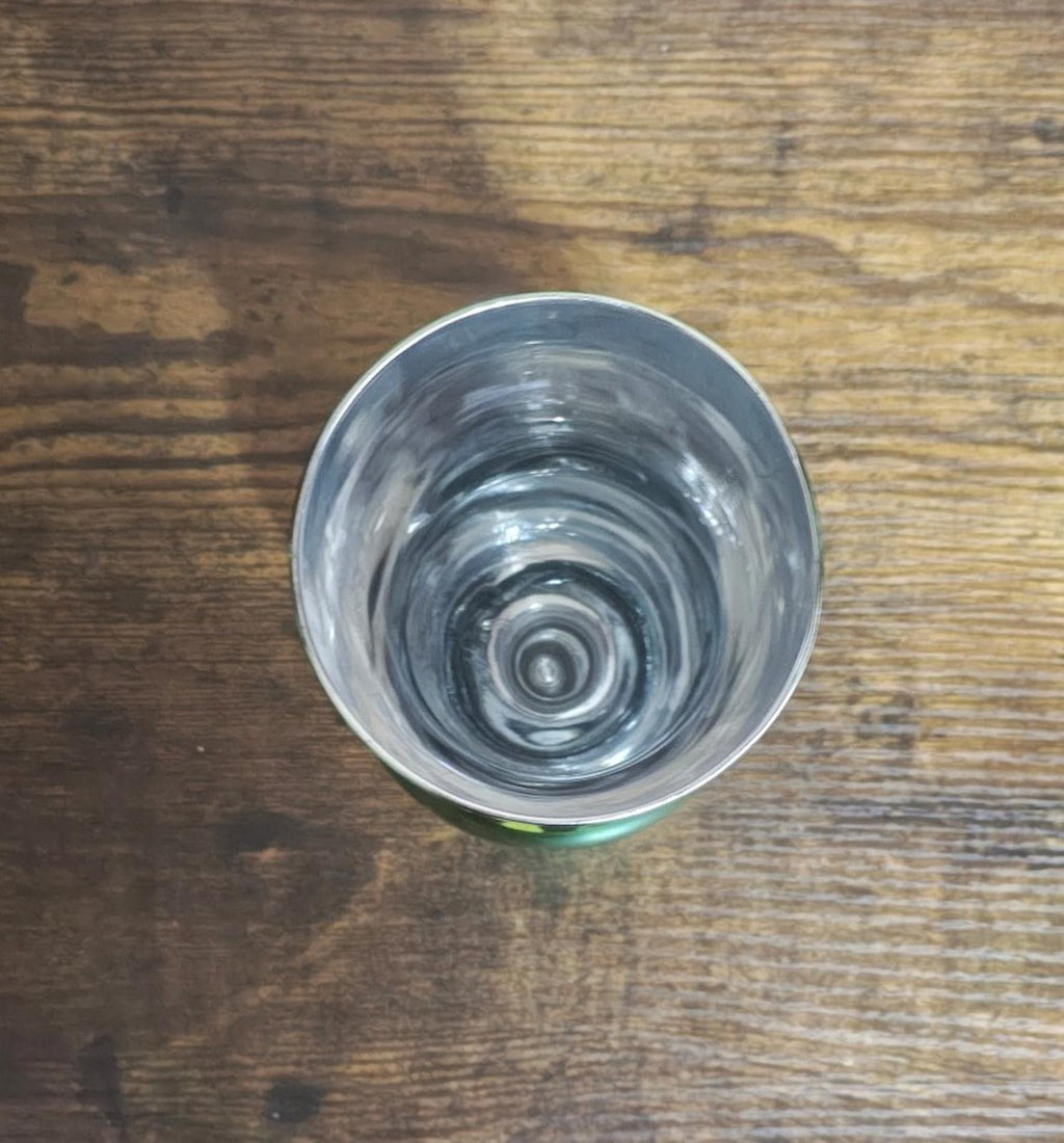 Green mirrored hurricane glass bottom view, clear interior with concentric glass rings.