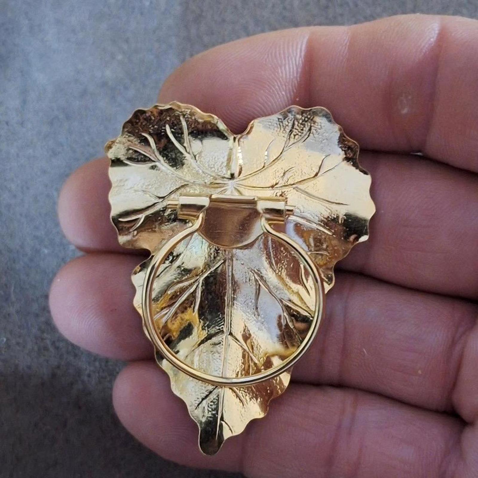 Gold-tone leaf scarf clip, backside view with hinged bar and round loop closure