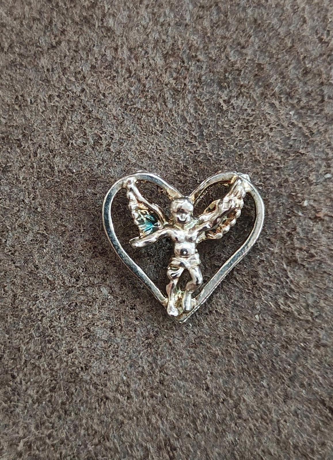 1980's Silver Tone Angel Inside A Heart Pin