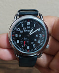 Men's leather-banded regulator watch with black dial, second sub-dial, dark strap