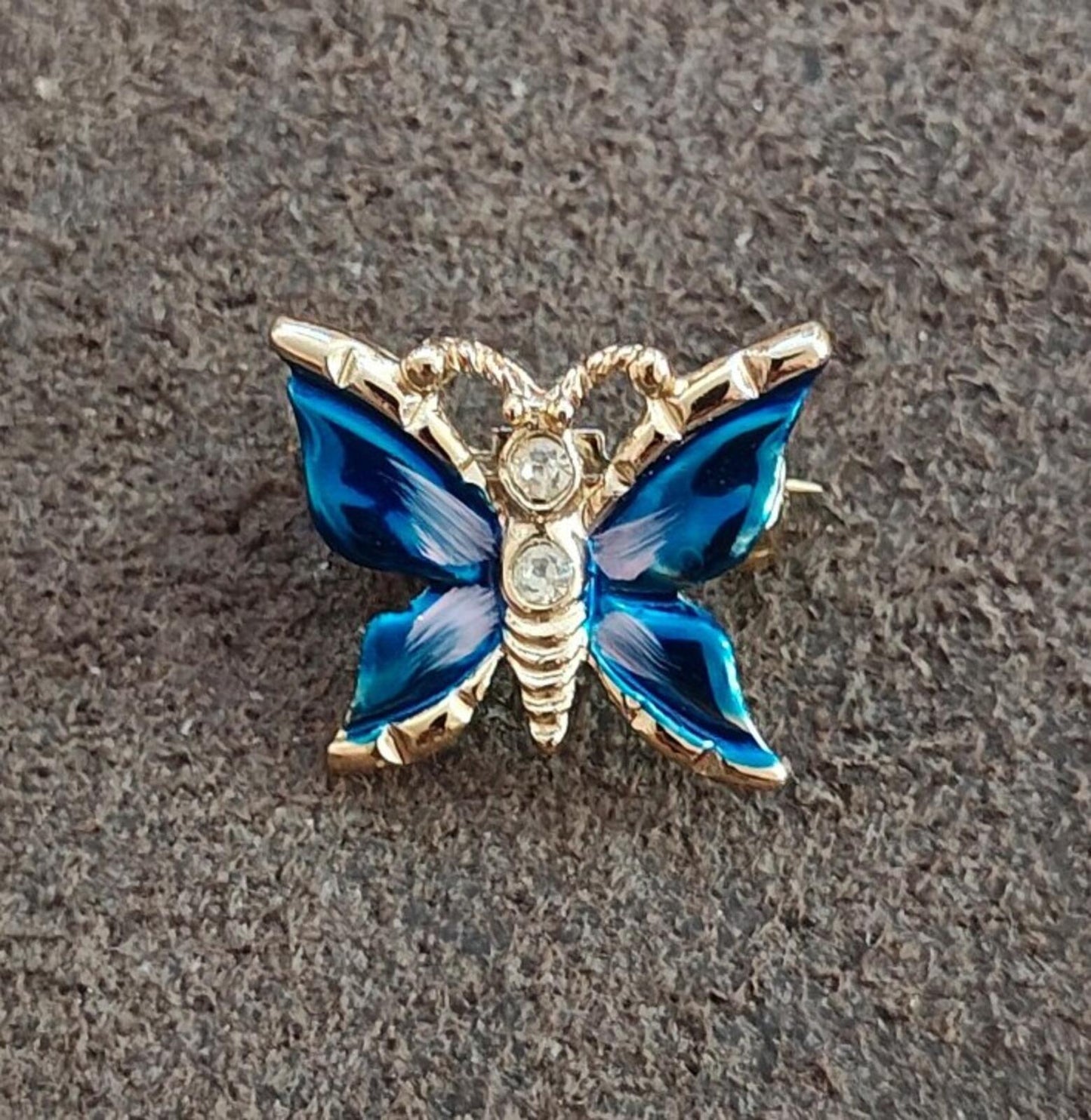 1980s Gold Tone Blue Enamel Butterfly Brooch Accented With Clear Rhinestones