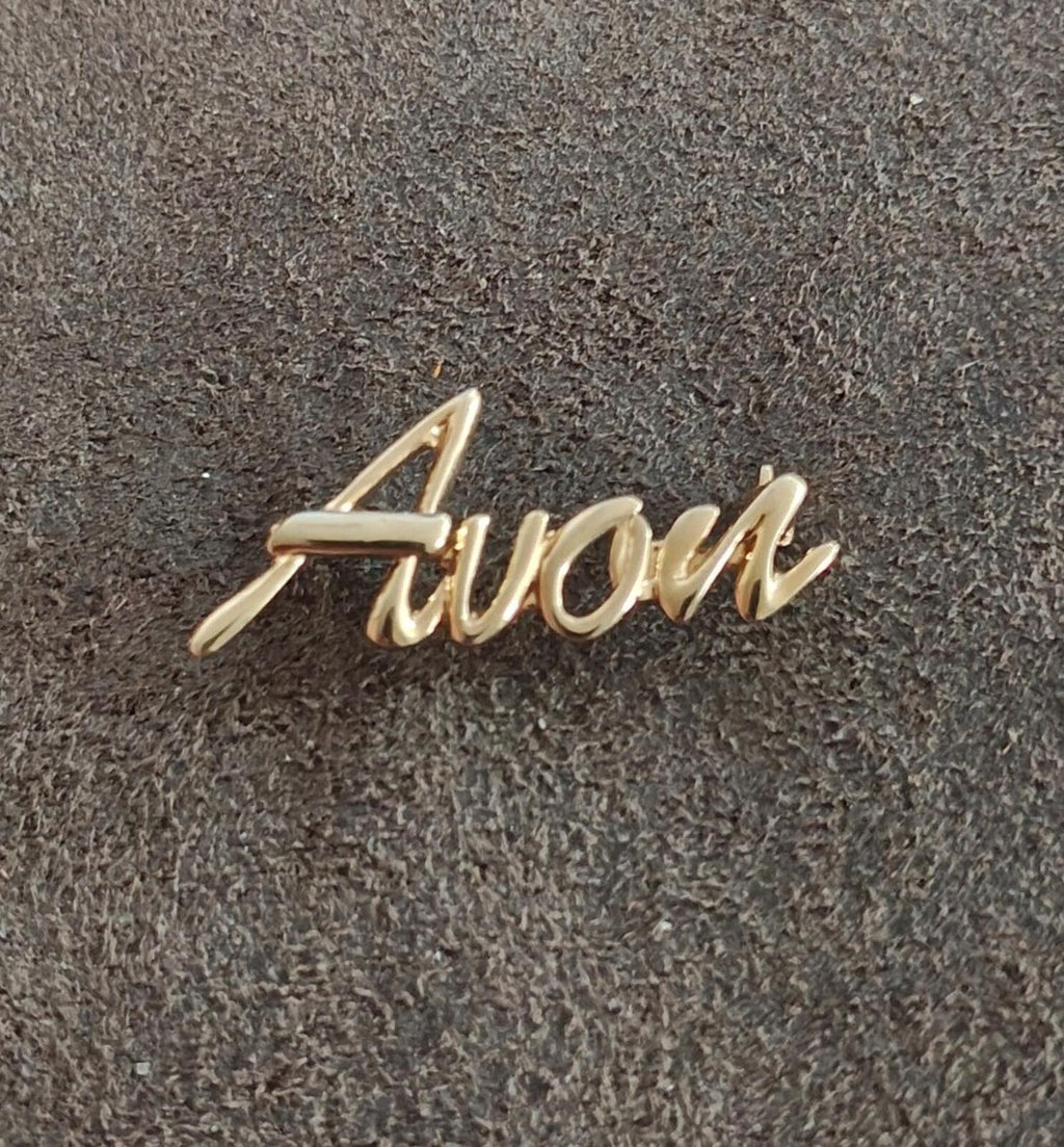 1980s/90s  Avon Gold Tone Cursive Logo Pin