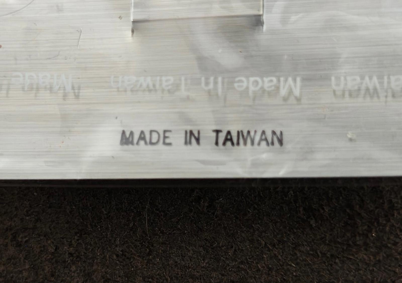 Brooch card shows 'MADE IN TAIWAN' text on the back
