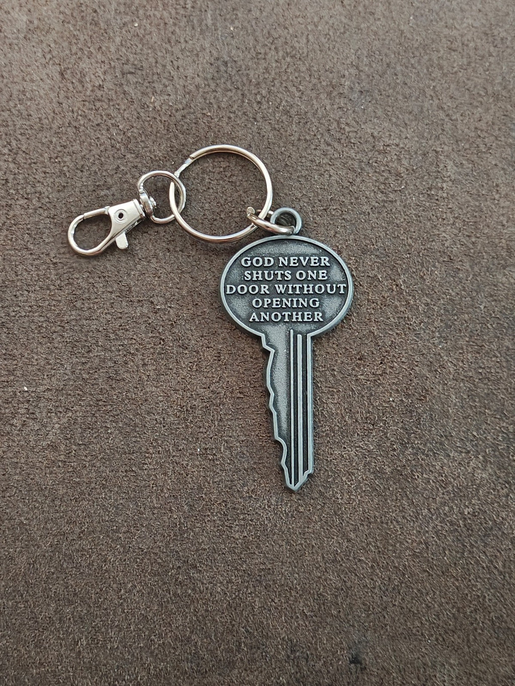 "God never shuts one door without opening another." Cast Metal Keychain