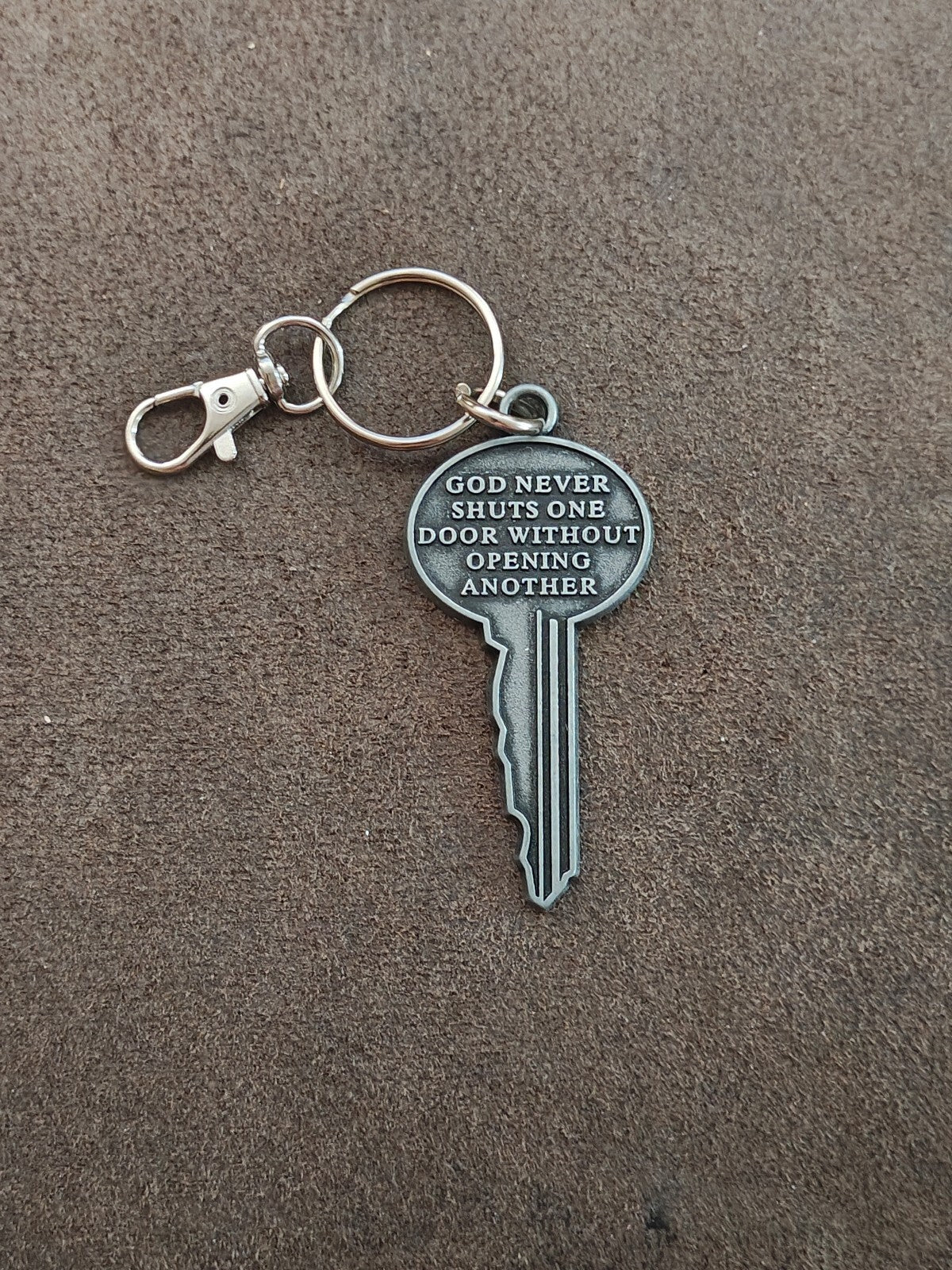 "God never shuts one door without opening another." Cast Metal Keychain