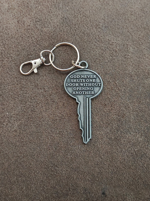 "God never shuts one door without opening another." Cast Metal Keychain