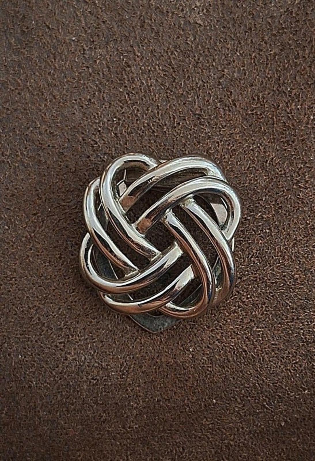 Silver love-knot scarf clip, compact round knot design with shiny edges