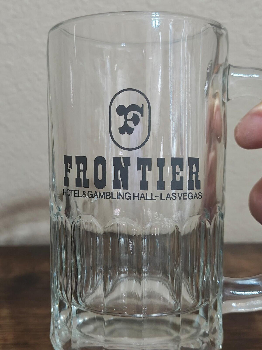 Clear glass beer mug with Frontier hotel & gambling hall Las Vegas text