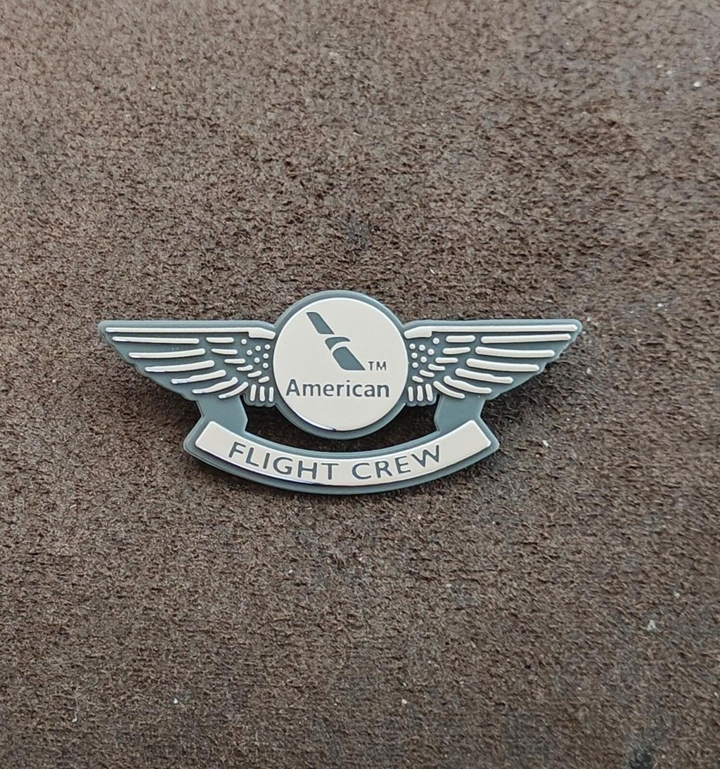 American Flight Crew badge pin, centered view of silver wings and Flight Crew badge