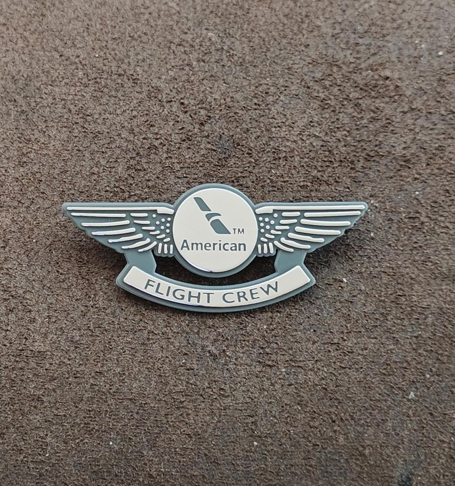 American Flight Crew badge pin, centered view of silver wings and Flight Crew badge