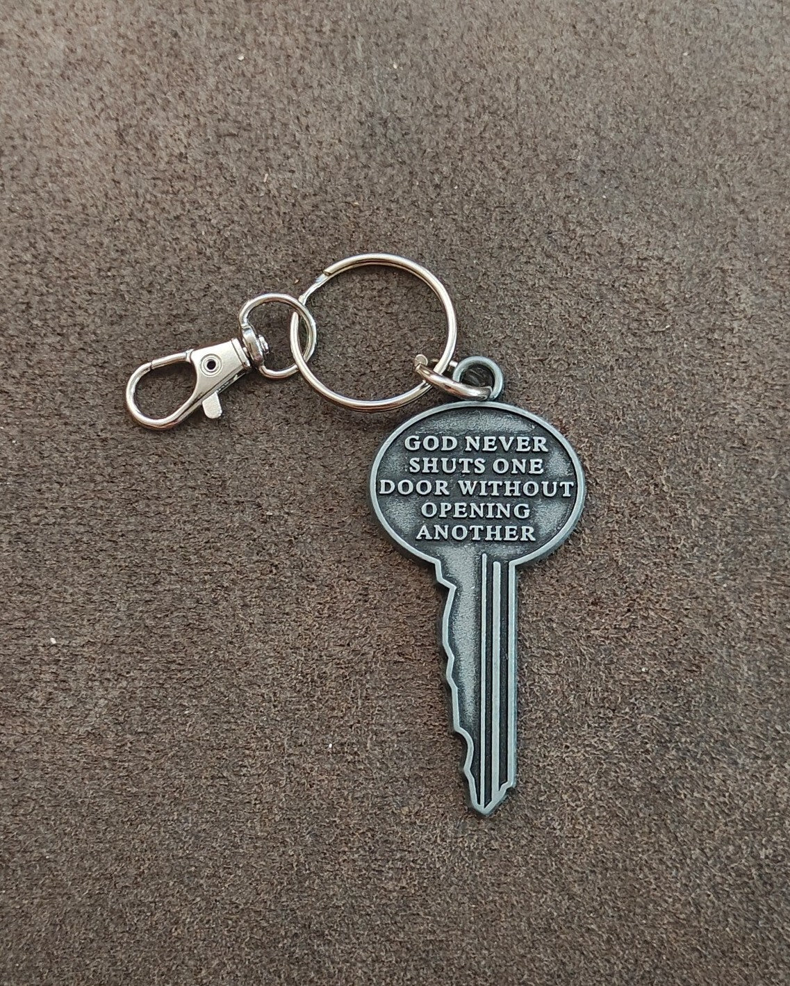 "God never shuts one door without opening another." Cast Metal Keychain