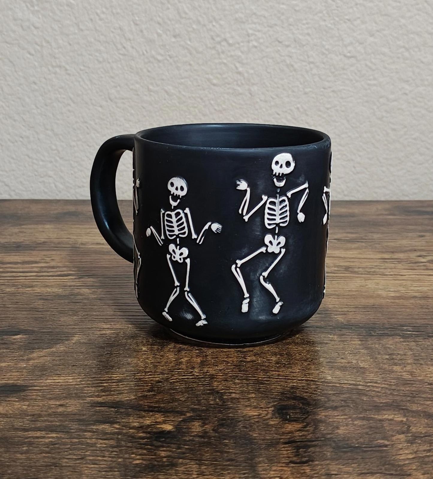 Dancing Skeletons Black Earthenware 13 oz 3D Embossed Black Mug.