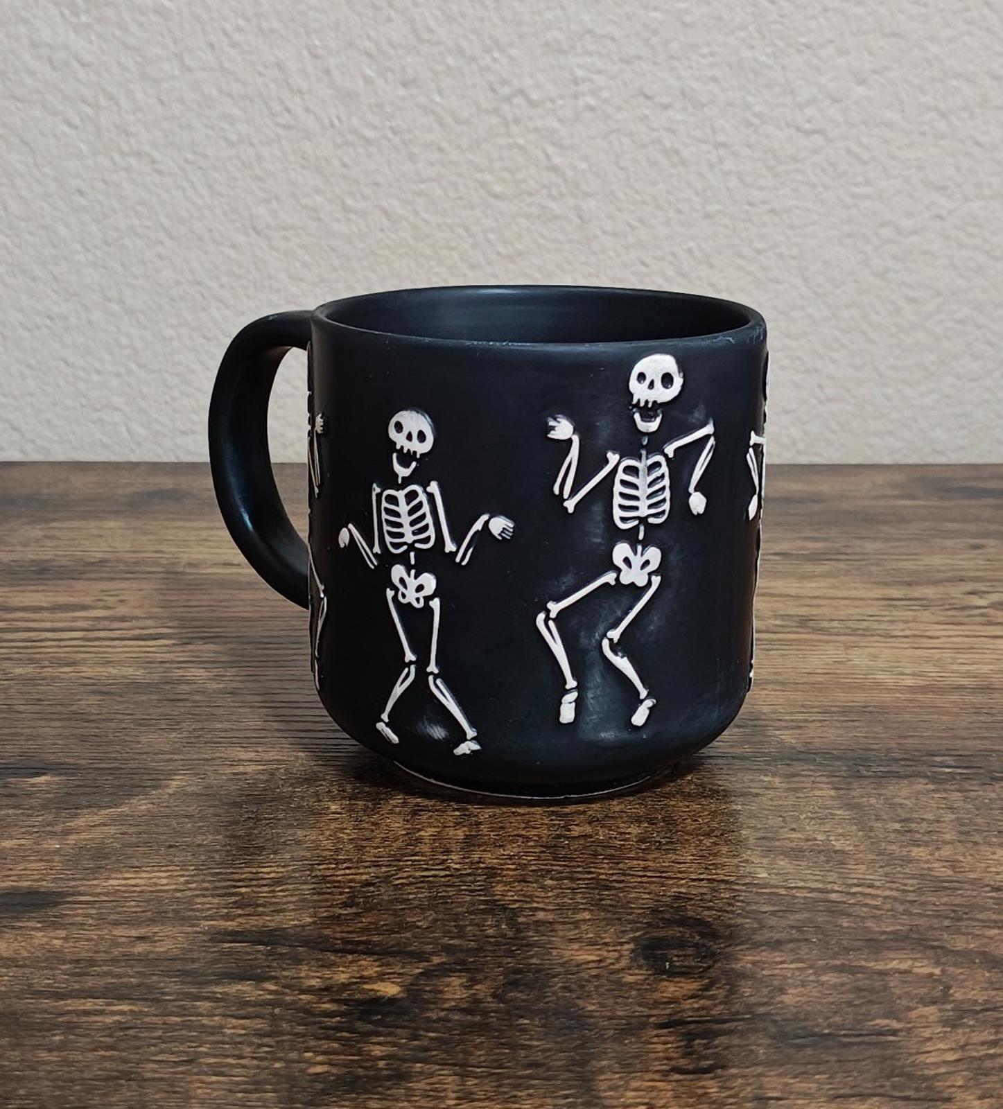 Dancing Skeletons Black Earthenware 13 oz 3D Embossed Black Mug.