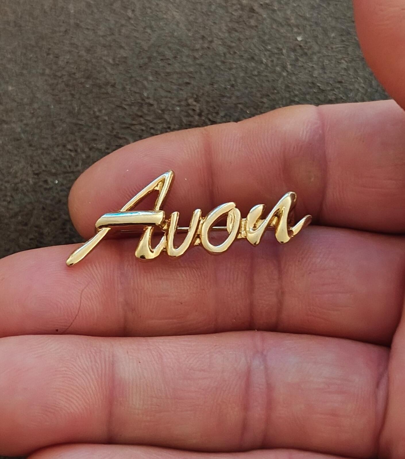 1980s/90s  Avon Gold Tone Cursive Logo Pin