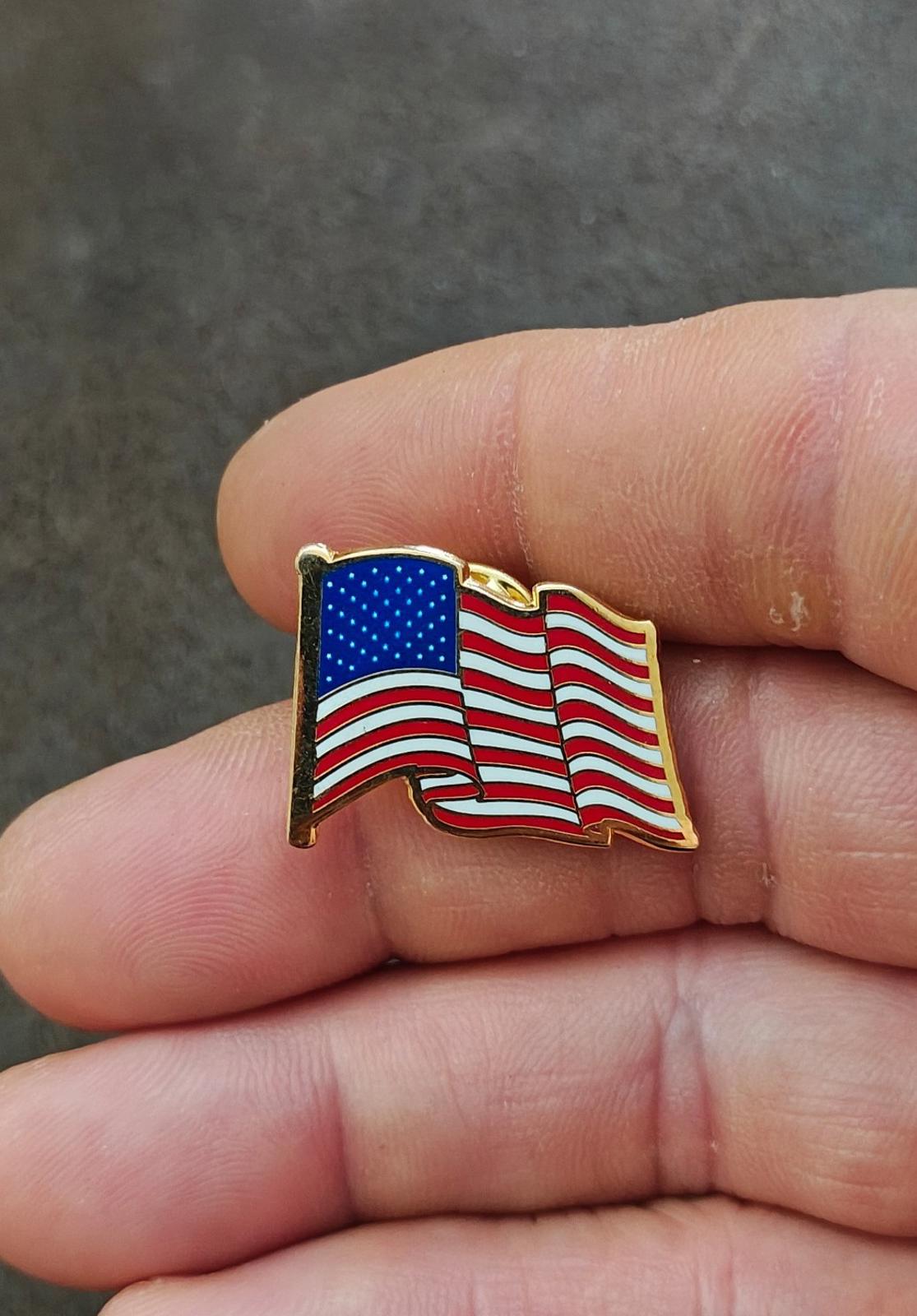 1980s Patriotic Gold Tone Enameled American Wavy Flag Pin.
