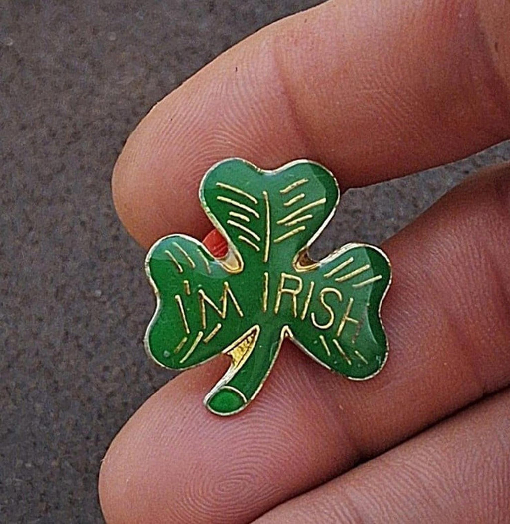 Green enamel shamrock pin with gold “IRISH” text and “I’m” lettering