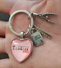 Pink heart teacher keychain charm with “Best Teacher Ever” text and silver ring