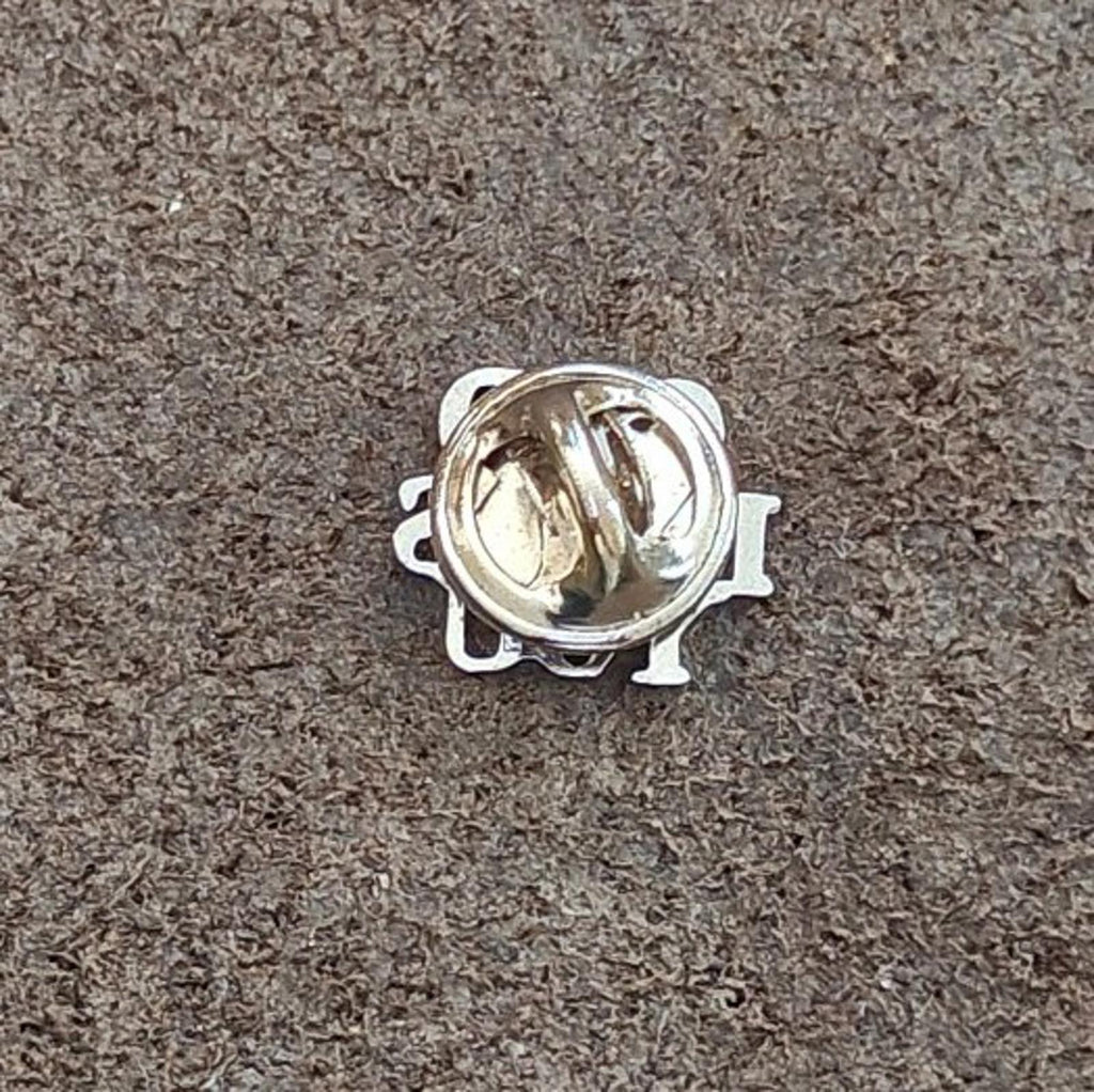 Back of sterling silver pin with safety clasp and hinge hardware