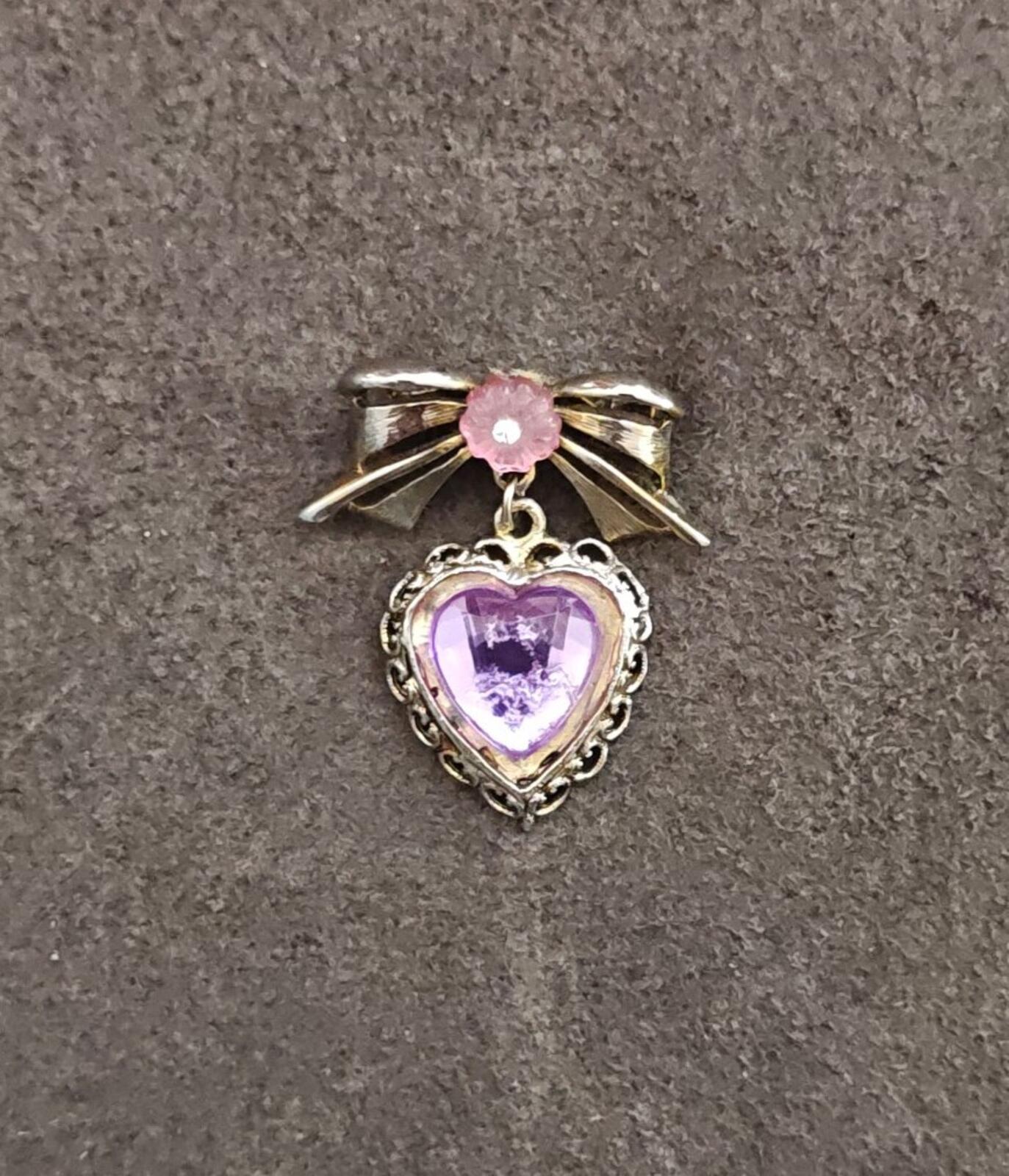 1980s Gold Tone Bow With Pink Flower & Filigree Edged Purple Stone Heart Brooch