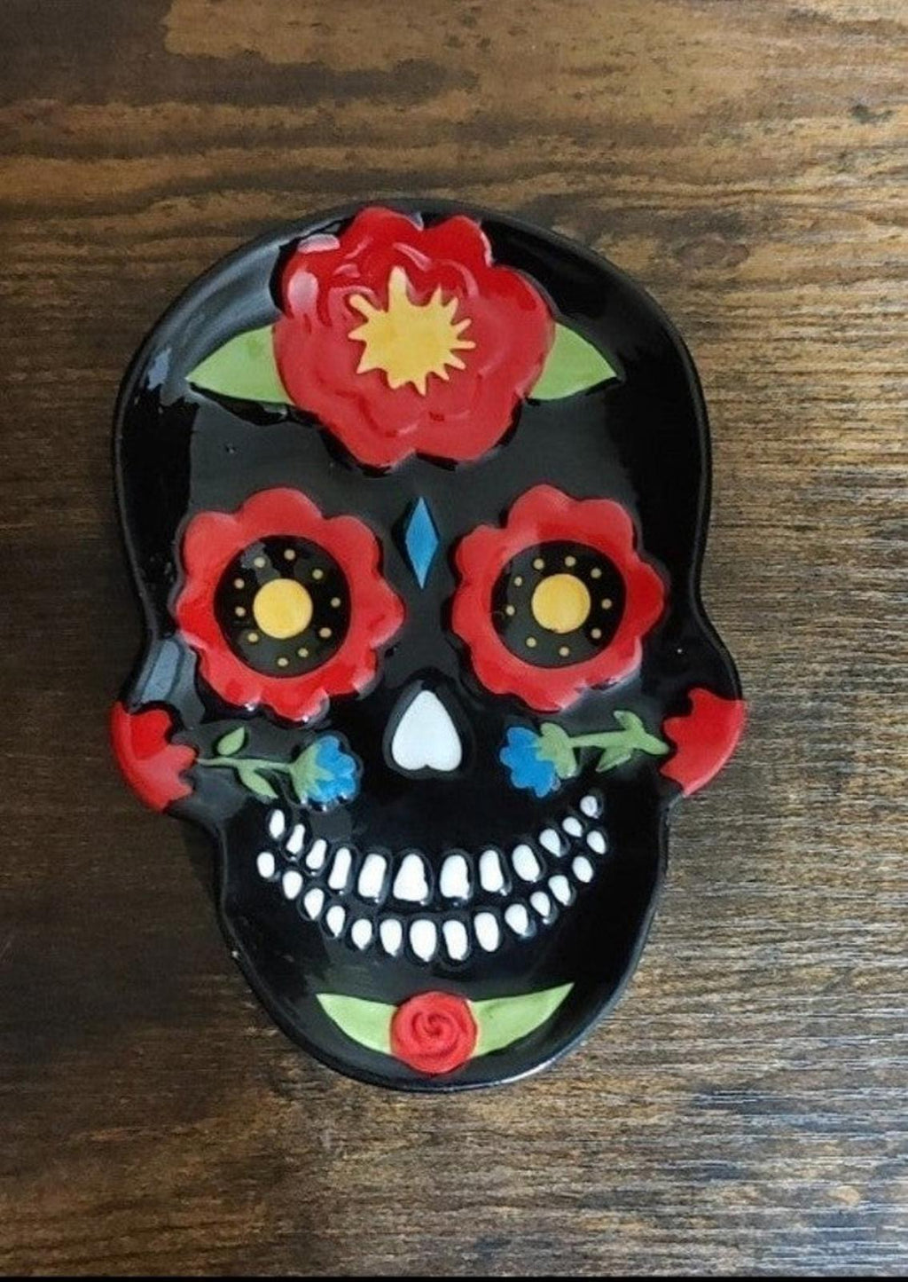Single black sugar skull cat trinket plate with red flowers and bright white teeth
