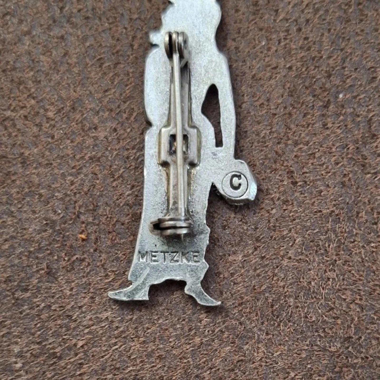 Metzke pewter brooch pin back, clasp pin and METZKE mark visible, silver-tone